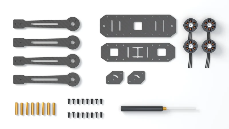 A generic 5-inch carbon quadcopter frame kit laid out with motors and hardware.
